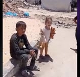 a man and a child are playing with a camera