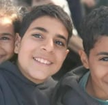 a group of young children posing for a picture