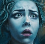 a frightened woman with blue hair and blue eyes