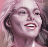 a joyful woman with blonde hair and a pink shirt