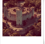 a castle like structure with a tower in the middle of it