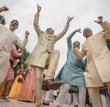 a group of men and women in traditional indian attire