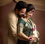 a man and woman in traditional indian attire