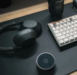 a keyboard and a laptop computer sitting on a desk