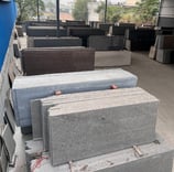 a pile of granite slabs in a gold stone granites mohali warehouse