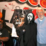 Nightmare Cafe Las Vegas trivia winners Sam Glass and Woody Goulart with Ghost Face character