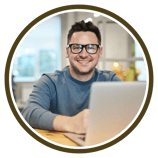 a man with glasses and a laptop computer