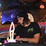 a man sitting at a dj table