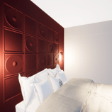 Chambre secondaire appartement Knokke tête de lit bordeau relief Orac
