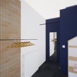 Zoom sur le projet de rénovation avec des murs bleus et des étagères