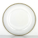 Gold-rimmed charger plates to hire