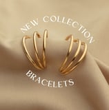 a pair of gold - plated earrings