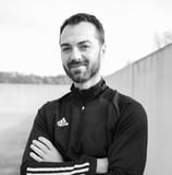 a man with a beard and a black and white photo