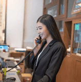 Concierge answering a guest call — part of Vision Immo Bali’s personalized villa management service