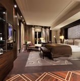 a bedroom with a bed and a glass shelf