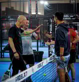 Group of players showing sportsmanship after a padel match