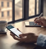 black smartphone showing white medication pill