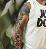 a man with a tattoo on his arm