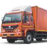 a truck with a red container on it