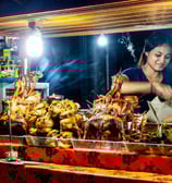 bali food tour: at night market a food vendor