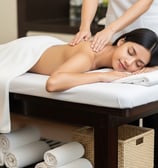 a woman getting a massage at a spa