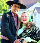 a man and woman in a Chilean hat and a black dress
