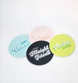a pile of four stickers with queer identity themes