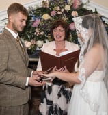 Vintage style Hertfordshire Bride & Groom holding hands as they say their vows