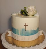 a cake with a cross on top of it