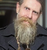a bearded man posing