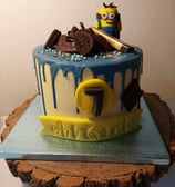 a cake with a minion on top of it