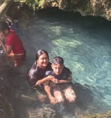 Relaxing in the water in Busay Cave