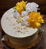 a cake with flowers on a plate