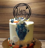 a cake with a motorcycle themed cake topper