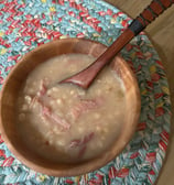 Large Silver Maple bowl with ham and bean soup and a wooden spoon