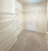 a closet with a closet space for clothes and other items
