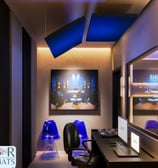 a desk with a computer and a chair