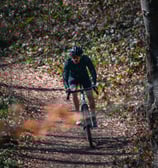 a man riding a bike on a trail
