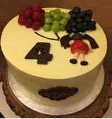 a cake with a bunch of fruit on it