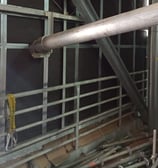 a pipe pipe in a building with pipes and pipes