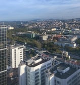 a city skyline view of a city with a clock tower