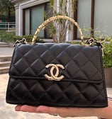 coach bolso clasico mini negro con agarradera negra