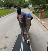 Full Motion Mover is moving down a ramp with a grandfather clock in fort worth, texas