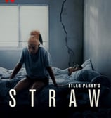 Black woman sitting on bed with head bent down