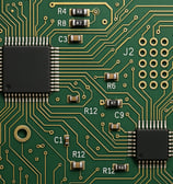 a close up of a computer motherboard with a circuit board
