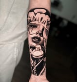 Chicano Payasa graffiti black and grey tattoo on forearm