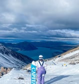 a person standing on a snowy mountain top