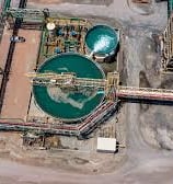 a large zinc processing plant with a lot of tanks