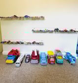 an organized wall of cars and trucks