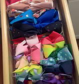 an organized drawer or colorful bows